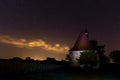 Old chapel in the village of Dobronice, under the night sky. Royalty Free Stock Photo