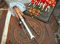 Old charcoal grill with delicious poultry skewers and peppers as well as mushrooms at a barbecue Royalty Free Stock Photo