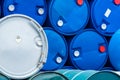 Old chemical barrels. Blue and green oil drum. Steel and plastic oil tank. Toxic waste warehouse. Hazard chemical barrel with Royalty Free Stock Photo