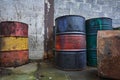 Old chemical barrels. Blue, green red and rusty oil drum. Steel oil tank. Toxic waste warehouse. Hazard chemical barrel Royalty Free Stock Photo