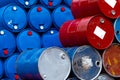 Old chemical barrels. Blue and red oil drum. Steel and plastic oil tank. Toxic waste warehouse. Hazard chemical barrel with Royalty Free Stock Photo