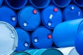 Old chemical barrels. Empty blue chemical drums stack. Steel and plastic oil tank. Toxic waste warehouse. Hazard chemical barrel. Royalty Free Stock Photo