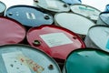 Old chemical barrels stack. Red, green, and blue chemical drum. Steel tank of flammable liquid. Hazard chemical barrel. Industrial