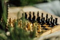 Old chess board set for a new game on the table. Selective focus Royalty Free Stock Photo