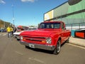 Old 1967 Chevrolet C10 pickup truck in the street. Colorful industrial background. Classic car show