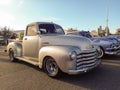 Old 1947 Chevrolet Loadmaster pickup truck Advance Design hot rod in a parking lot. Classic car show