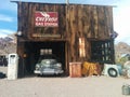 Old Chevron gas station with car inside Royalty Free Stock Photo