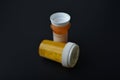 old child proof pill bottles on a black background Royalty Free Stock Photo