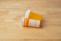 Old child proof pill bottles on a table Royalty Free Stock Photo