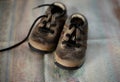 Old children brown boots lying on the floor Royalty Free Stock Photo