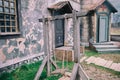Old Children`s Wooden Swing In The Yard Of A Vintage Catholic Church