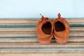 Old children sneakers a wooden background