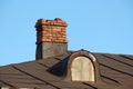 Old chimney on a house roof