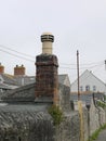Old chimney and stone wall Royalty Free Stock Photo