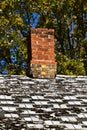 Old chimney and worn-out shingles Royalty Free Stock Photo