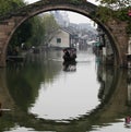 The boat under the stone arch bridge Royalty Free Stock Photo