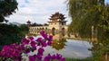 Old chinese bridge and bougainvillea. Jianshui, Yunnan, China Royalty Free Stock Photo