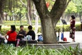 Old chinese people meet friends and sing song with playing classic musical instruments concert in park at Guangdong, China