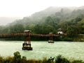 The old Chinese style bridge on the river of Dujiangyan, Sichuan, China Royalty Free Stock Photo