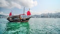 Old Chinese traditional fishing boat Junk that serves as a tourism at Victoria Habour in Hong Kong Royalty Free Stock Photo