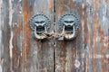 Old chinese traditional wooden gate with Lion door knockers Royalty Free Stock Photo