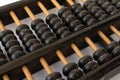 Old Chinese wooden ancient abacus isolated on white background. Calculating and counting number tool. Mathematics. Analog