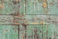 Old chipped wooden teal blue plank with staples texture background