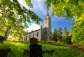 Old christian church and graveyard in the park Royalty Free Stock Photo