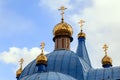 Old Christian church in Kemerovo with golden and gilded domes an Royalty Free Stock Photo