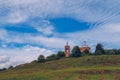 Old Christian orthodox church on the hill during sunny summer day with blue sky and clouds background landscape. Russia Royalty Free Stock Photo