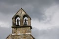 Old church bell tower with a grey sky Royalty Free Stock Photo