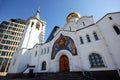 The old Church with a bell tower and a modern building Royalty Free Stock Photo