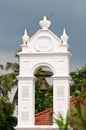 Old church bell in white arch