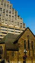 Old church building surrounded by new highrise buildings in Toronto Royalty Free Stock Photo