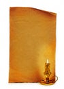 Old church burning candle on the background of vintage sheet of paper. Royalty Free Stock Photo