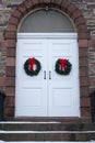 Old Church Door with Christmas Wreaths Royalty Free Stock Photo