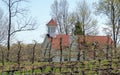 Old church on the edge of a fruit orchard
