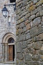 Old church entrance in the medieval village of La Garde Guerin Royalty Free Stock Photo