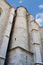 Old church exterior stone walls and columns with small windows (oculus) Royalty Free Stock Photo