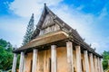 Old church isosceles made of wood on blue sky background