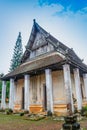 Old church isosceles made of wood on blue sky background