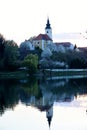 Old church with its reflection in the river Royalty Free Stock Photo