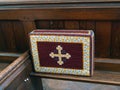 Church kneeler on wooden pew, for Christian prayer. Royalty Free Stock Photo