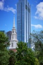 Old Church by Modern Blue Tower