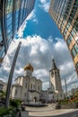 An old church next to a modern business center Royalty Free Stock Photo