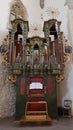 Old church pipe organ with colorful details Royalty Free Stock Photo