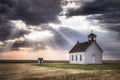 An old church on the prairie under a stormy sky Royalty Free Stock Photo