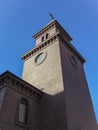 Old church in the rays of the setting sun. Church on a background of blue clear sky