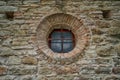 Old church round window on bricks wall Royalty Free Stock Photo