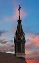 An Old Church Steeple and Cross at Twilight Royalty Free Stock Photo